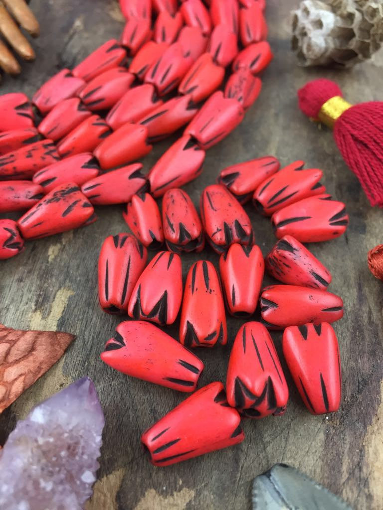 Orange Tribal Geometric Tulip: Hand Carved Bone Beads, 9x12mm, 16 pieces - ShopWomanShopsWorld.com. Bone Beads, Tassels, Pom Poms, African Beads.