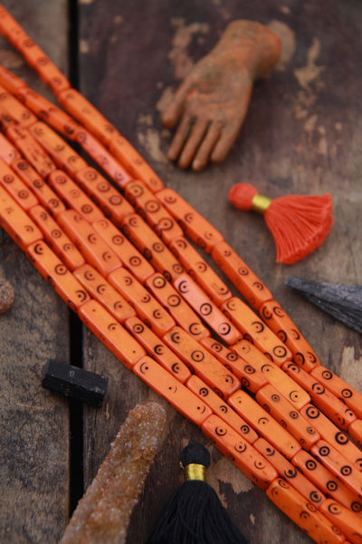 Orange Black Tribal Target Rectangle: Carved Bone Beads, 28x5mm, 9 pieces - ShopWomanShopsWorld.com. Bone Beads, Tassels, Pom Poms, African Beads.