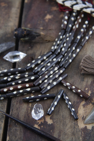 Brown Dotted Tube: White Polka Dot Bone Beads, 7x35mm, 5 pieces - ShopWomanShopsWorld.com. Bone Beads, Tassels, Pom Poms, African Beads.