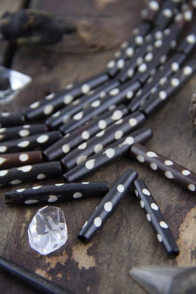 Brown Dotted Tube: White Polka Dot Bone Beads, 7x35mm, 5 pieces - ShopWomanShopsWorld.com. Bone Beads, Tassels, Pom Poms, African Beads.