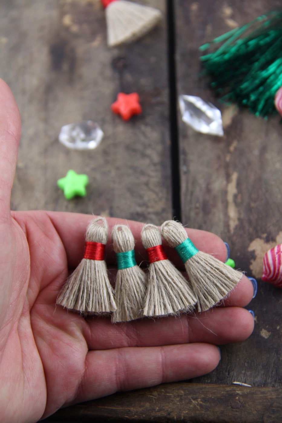 Christmas Mini Jute Tassels, 1.25" with Red & Green Binding, 4 pieces - ShopWomanShopsWorld.com. Bone Beads, Tassels, Pom Poms, African Beads.