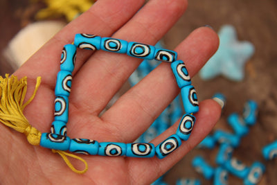 Turquoise Bullseye Tube: Aqua Blue Black White Bone Beads, 7x13mm, 16 pieces - ShopWomanShopsWorld.com. Bone Beads, Tassels, Pom Poms, African Beads.