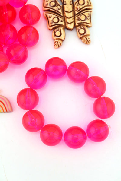 14mm Neon Pink beads that glow in a blacklight