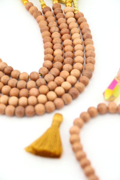 Handmade Indian wood beads, round 8mm size with smooth natural finish, styled with mustard tassel.