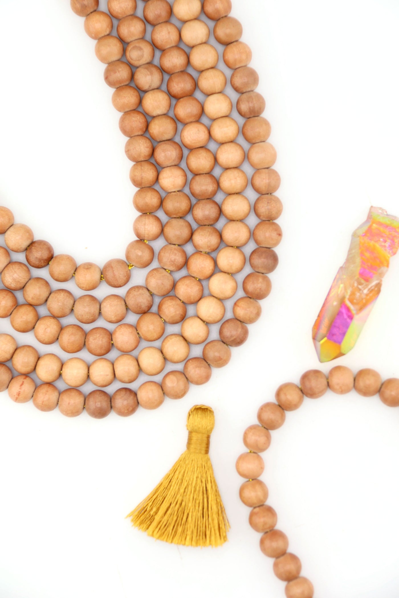 Handmade Indian wood beads, round 8mm size with smooth natural finish, styled with mustard tassel.