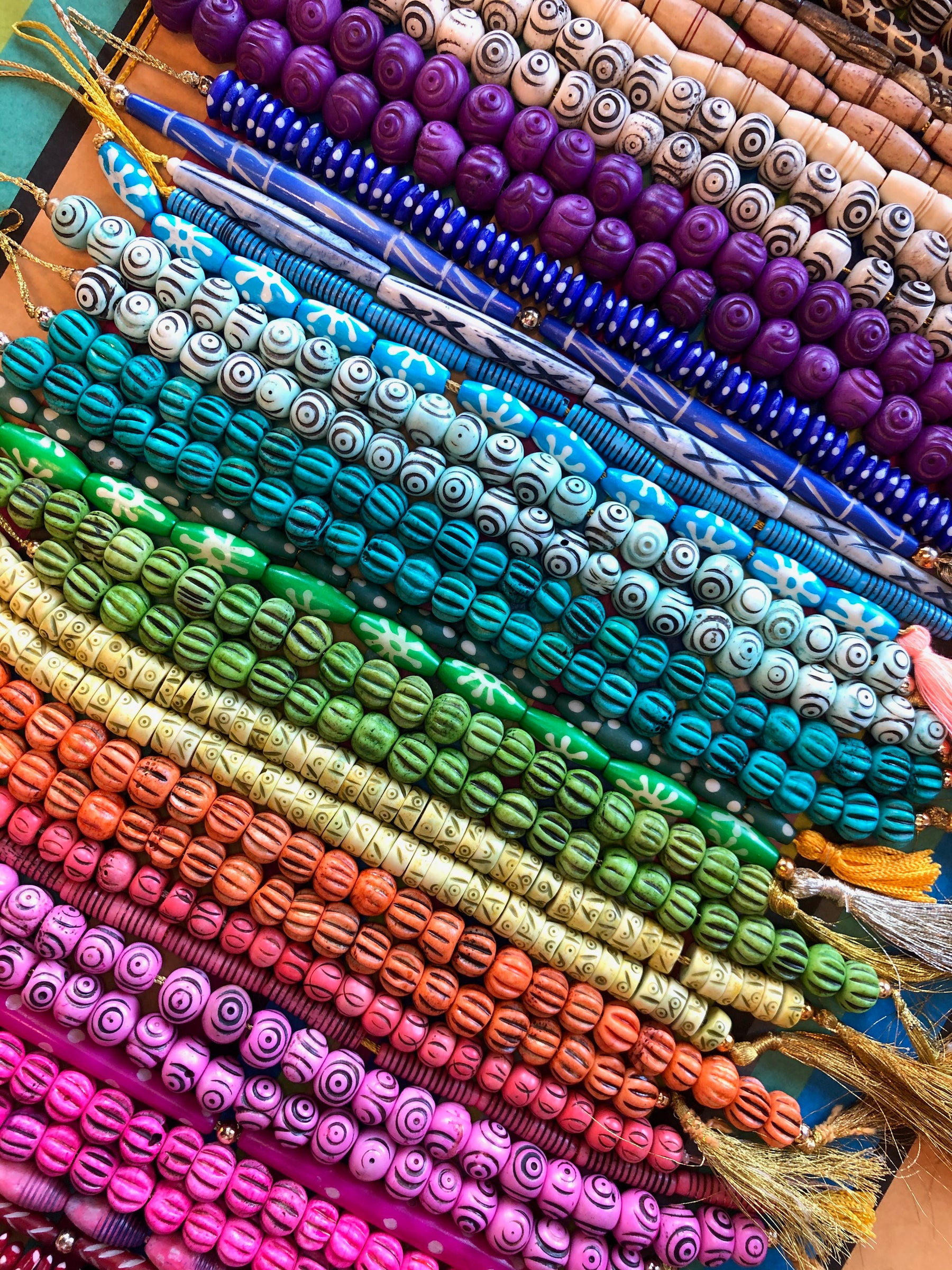 Artisan made handcrafted, handcarved bone beads. Rondelles, Heishi beads, skull beads, hairpipes, in 6mm, 8mm, 10mm, and many more assorted colors and sizes. We work directly with the artisans to offer you these ethically sourced beads.