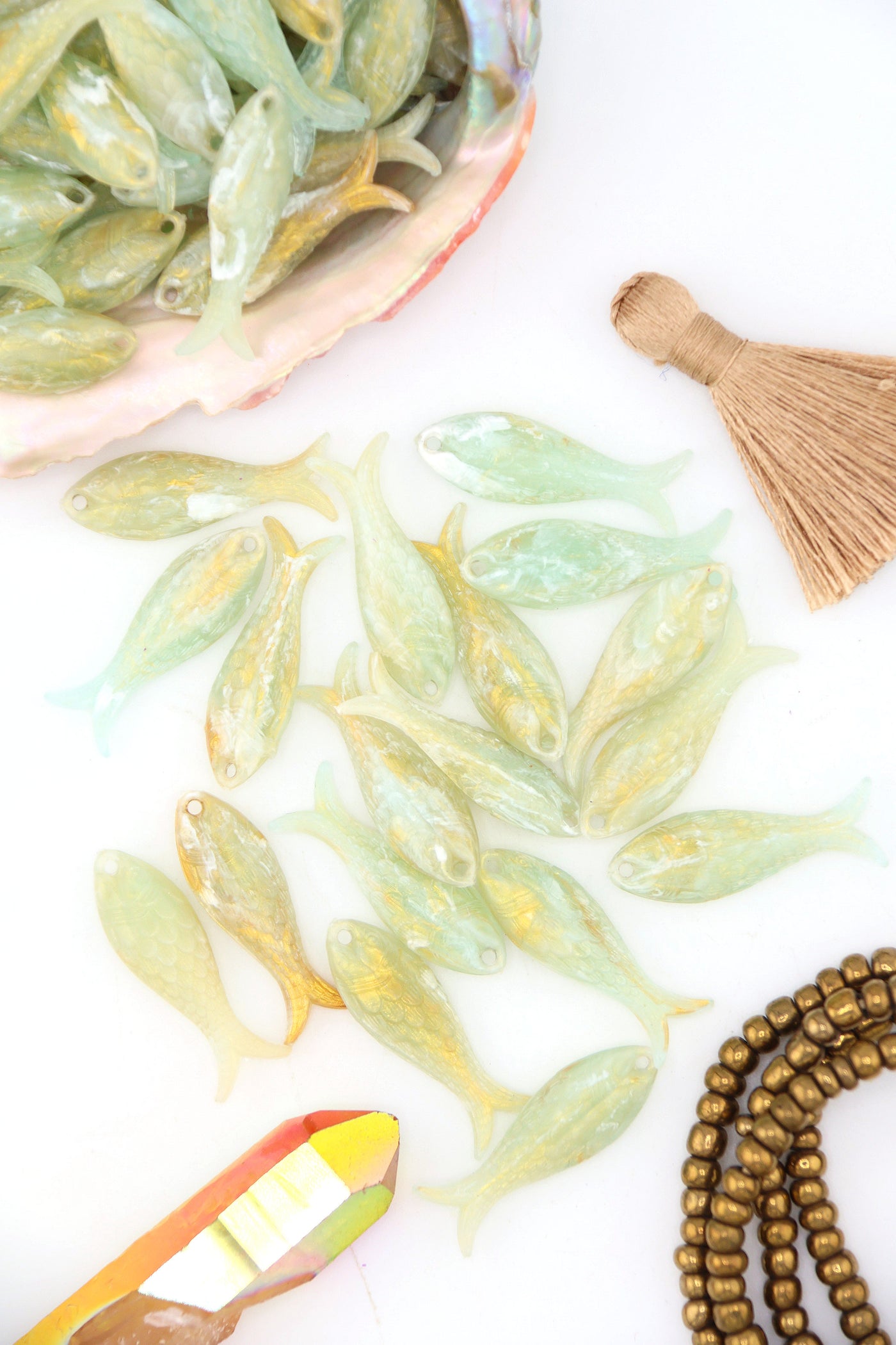 Golden Sage resin fish charms, 32x12mm. Soft sage green with golden shimmer, carved scale detail—perfect for DIY jewelry, earrings & mermaid-core designs.