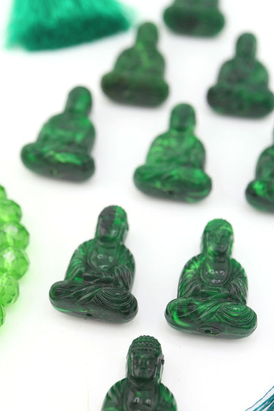 Closeup of marbled Rich Green Sitting Buddha Charms, Approx. 1" each, for making spiritual jewelry