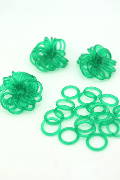 Translucent 18mm Green Vintage German Resin Rings in bundles on a white background