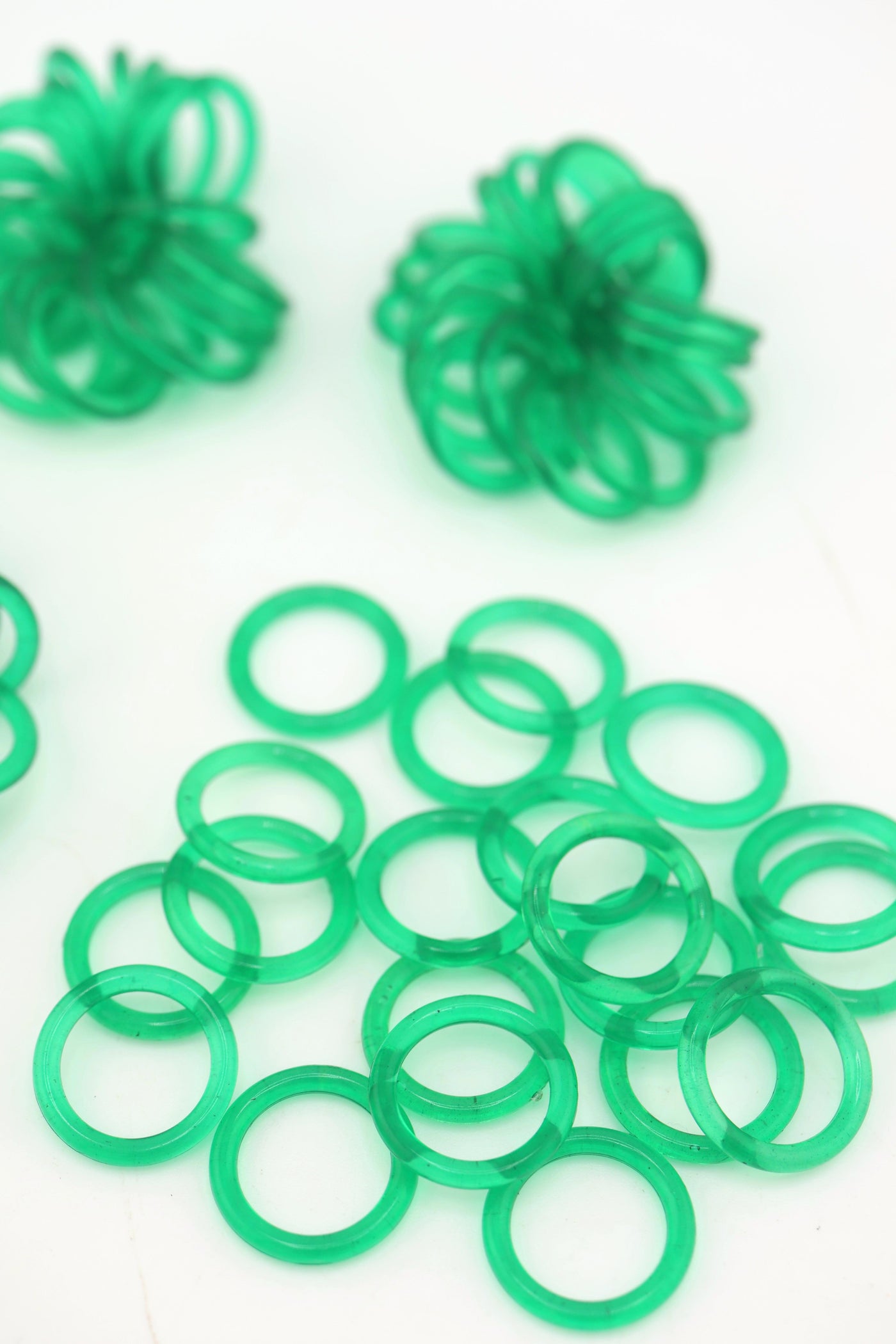 Translucent 18mm Green Vintage German Resin Rings in bundles on a white background