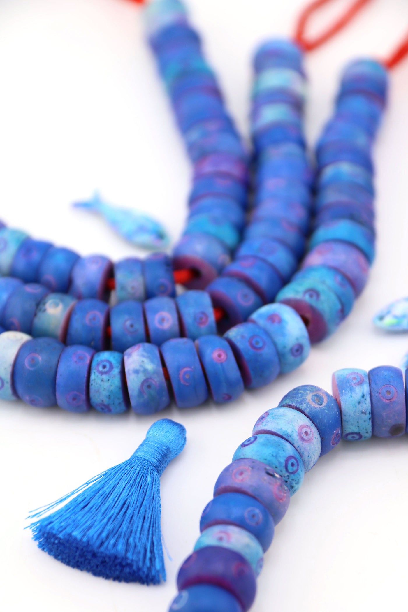 Blue donut carved bone beads, 14x7mm with bullseye accents. Ethically sourced, handmade, large-hole beads perfect for Primary Play DIY jewelry.