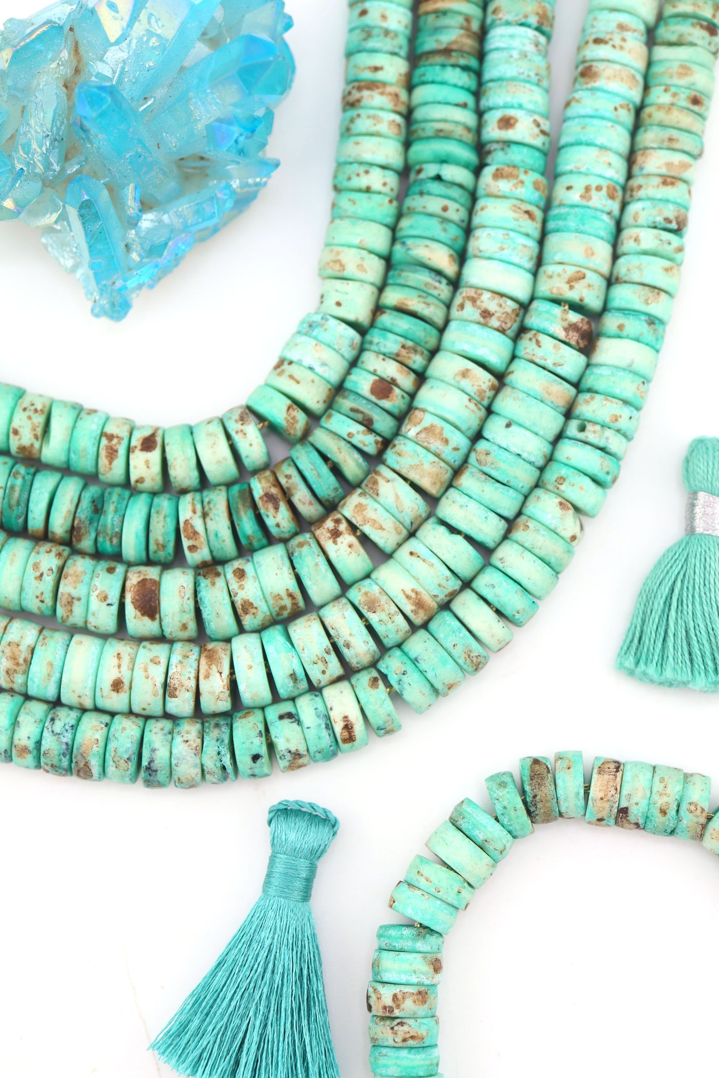 10mm Turquoise Speckled Disc Beads: Hand Carved Heishi Discs, 50 Beads, for DIY jewelry these mint disc beads are a versatile choice for fall-inspired designs. 