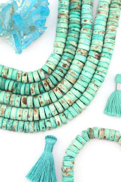 10mm Turquoise Speckled Disc Beads: Hand Carved Heishi Discs, 50 Beads, for DIY jewelry these mint disc beads are a versatile choice for fall-inspired designs. 