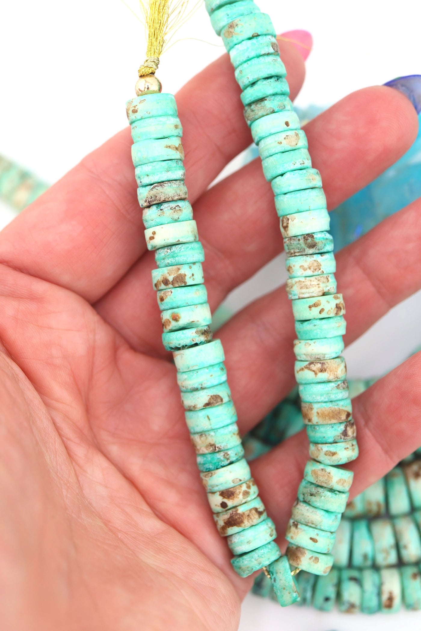 10mm Turquoise Speckled Disc Beads: Hand Carved Heishi Discs, 50 Beads, for DIY jewelry these mint disc beads are a versatile choice for fall-inspired designs. 