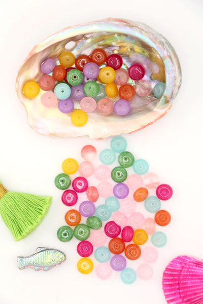 Pastel Rainbow Gemstone Beads, Loose Beads for DIY Necklace, shown spilling out of a large seashell.