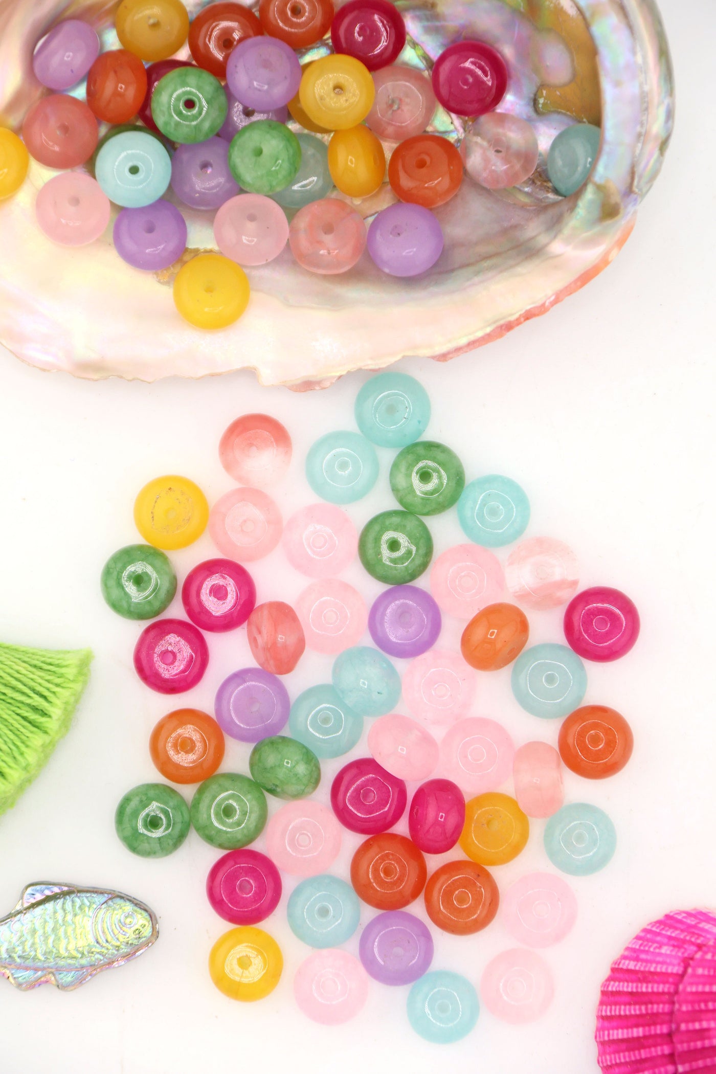 Pastel Rainbow Gemstone Beads, Loose Beads for DIY Necklace, shown spilling out of a large seashell.
