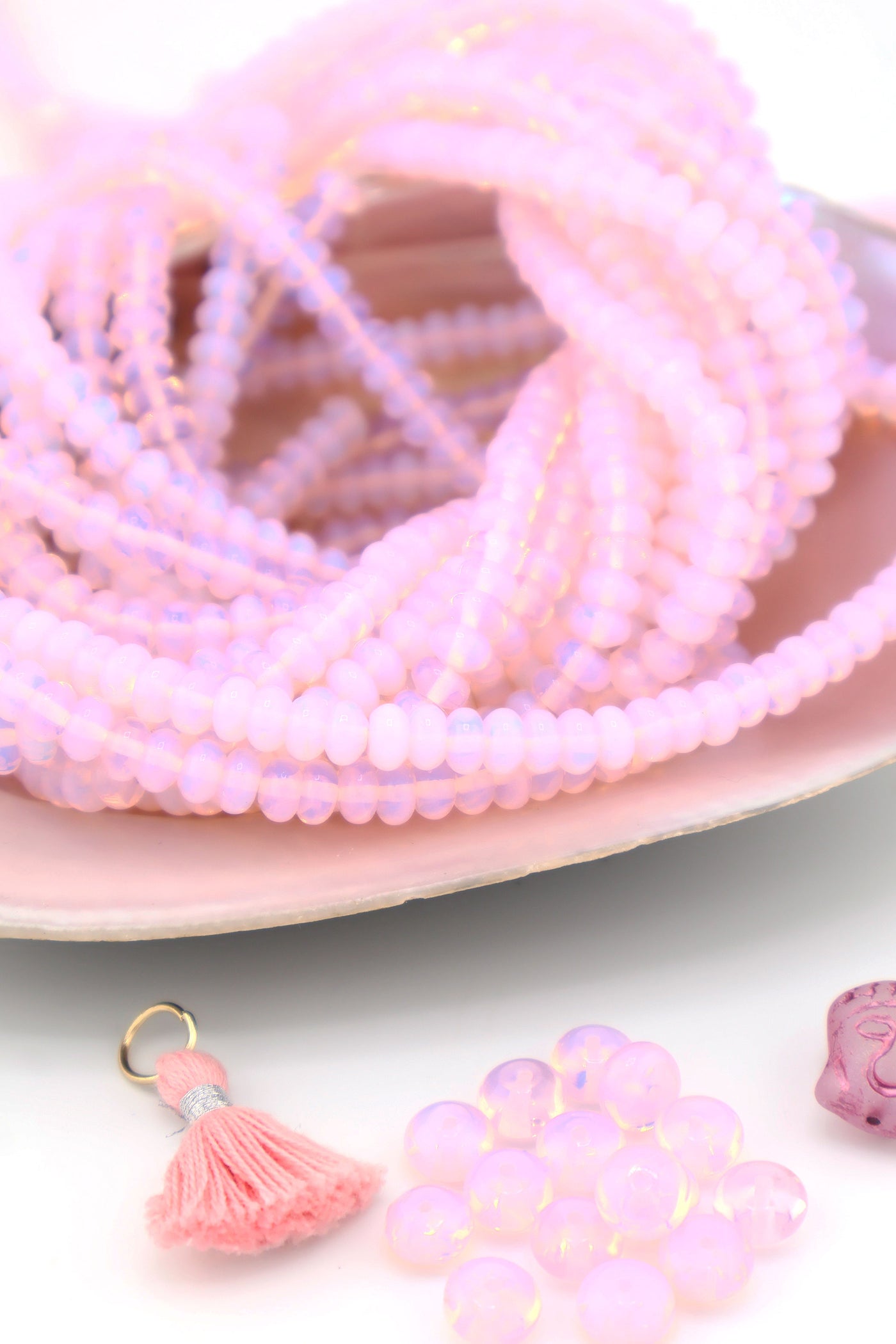 The galaxy-like pastel pink in these jellyfish opalite beads is great for beginner DIY jewelry.