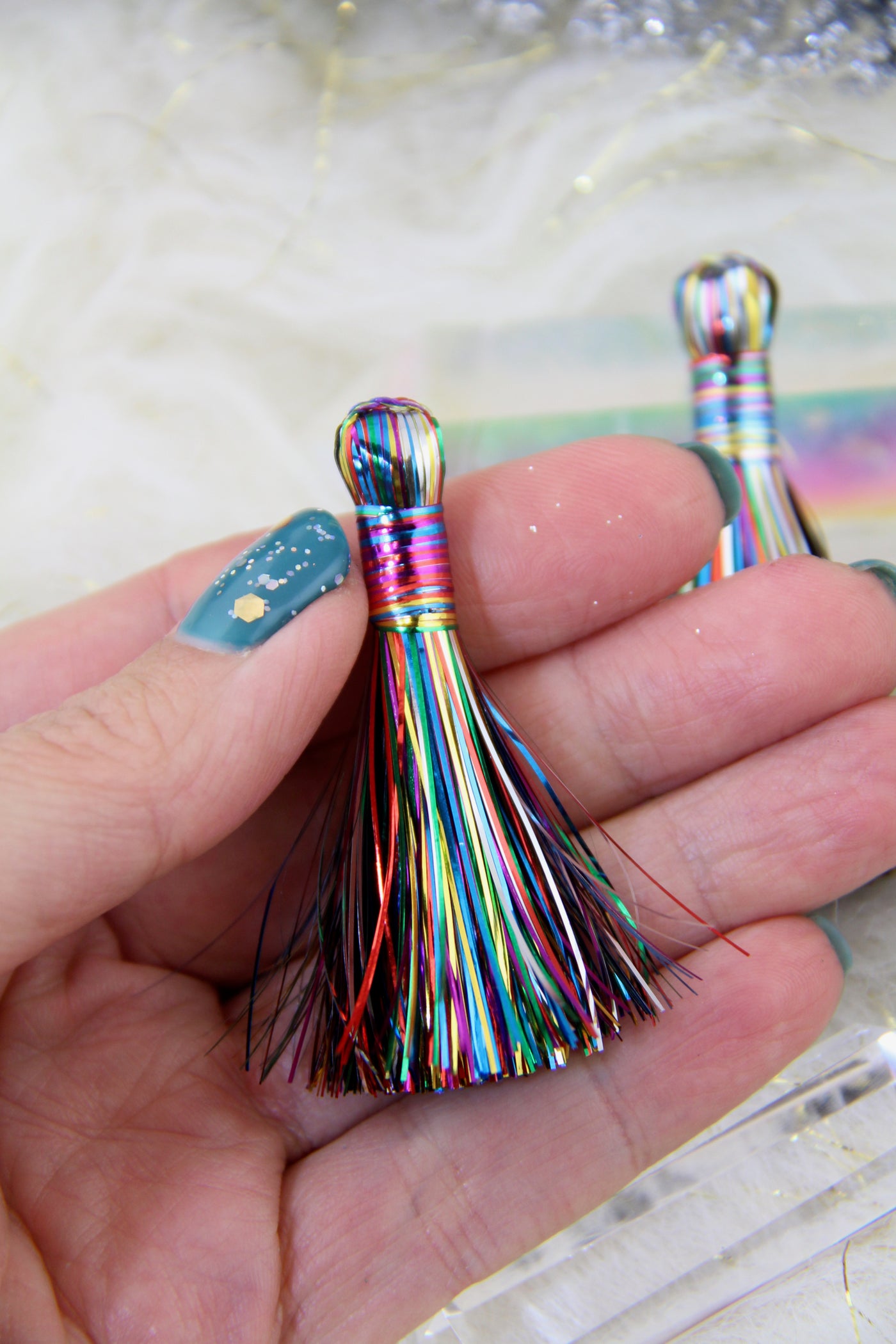 So sparkly and festive, these tassels are handcrafted from shimmering tinsel, in a rainbow of 
