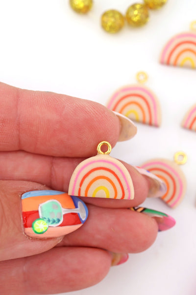 Rainbow Polymer Clay Charm in a hand, 17mm, 1 Handmade Sigfus Designs Pendant for making purse charms or DIY jewelry