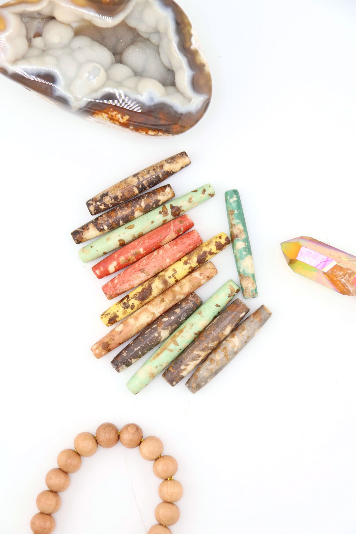 Hand-dyed speckled hairpipe bone beads in earthy mixed colors. 1.5” long, ethically sourced, artisan-made in India—perfect for boho jewelry