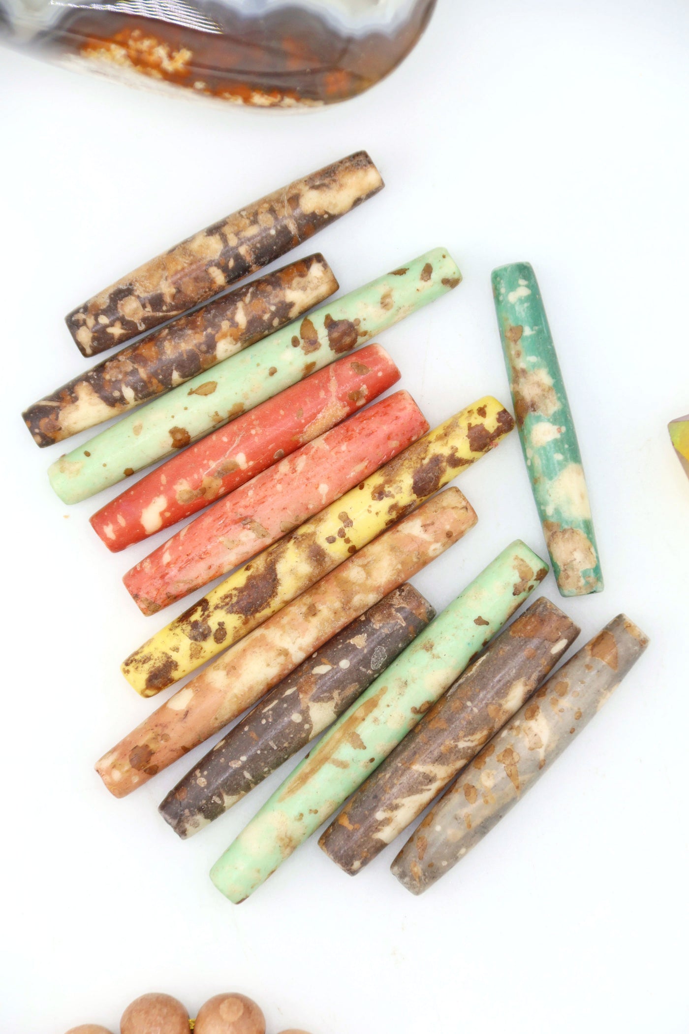 Hand-dyed speckled hairpipe bone beads in earthy mixed colors. 1.5” long, ethically sourced, artisan-made in India—perfect for boho jewelry
