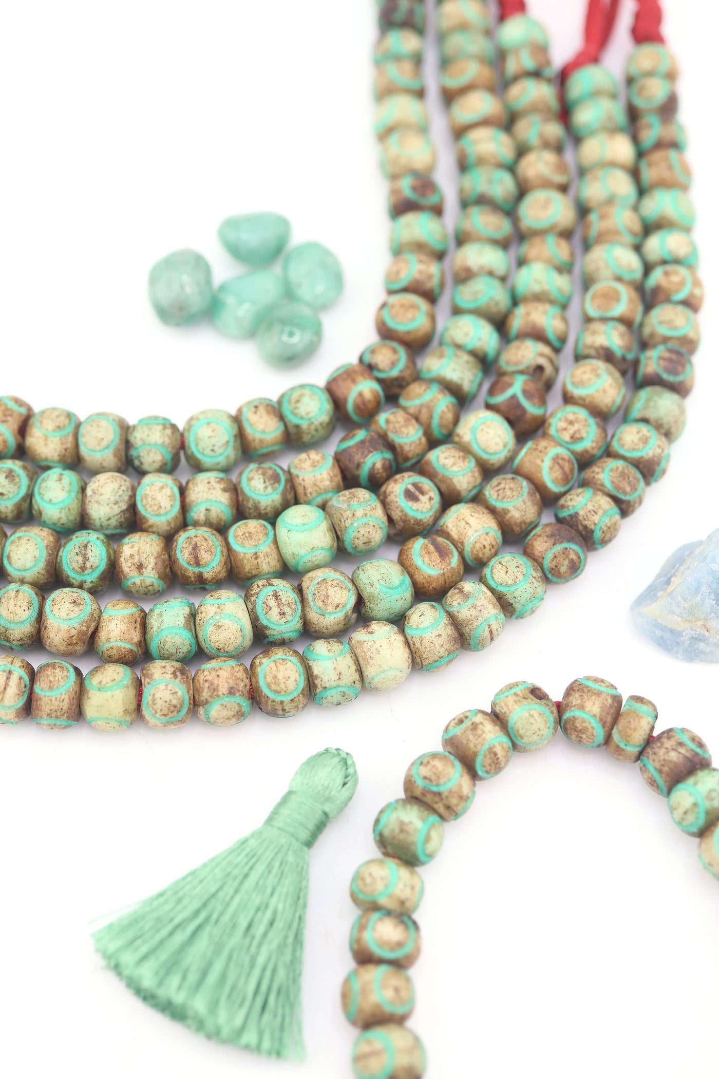 Artisan carved bone beads with turquoise painted accents, 8mm size