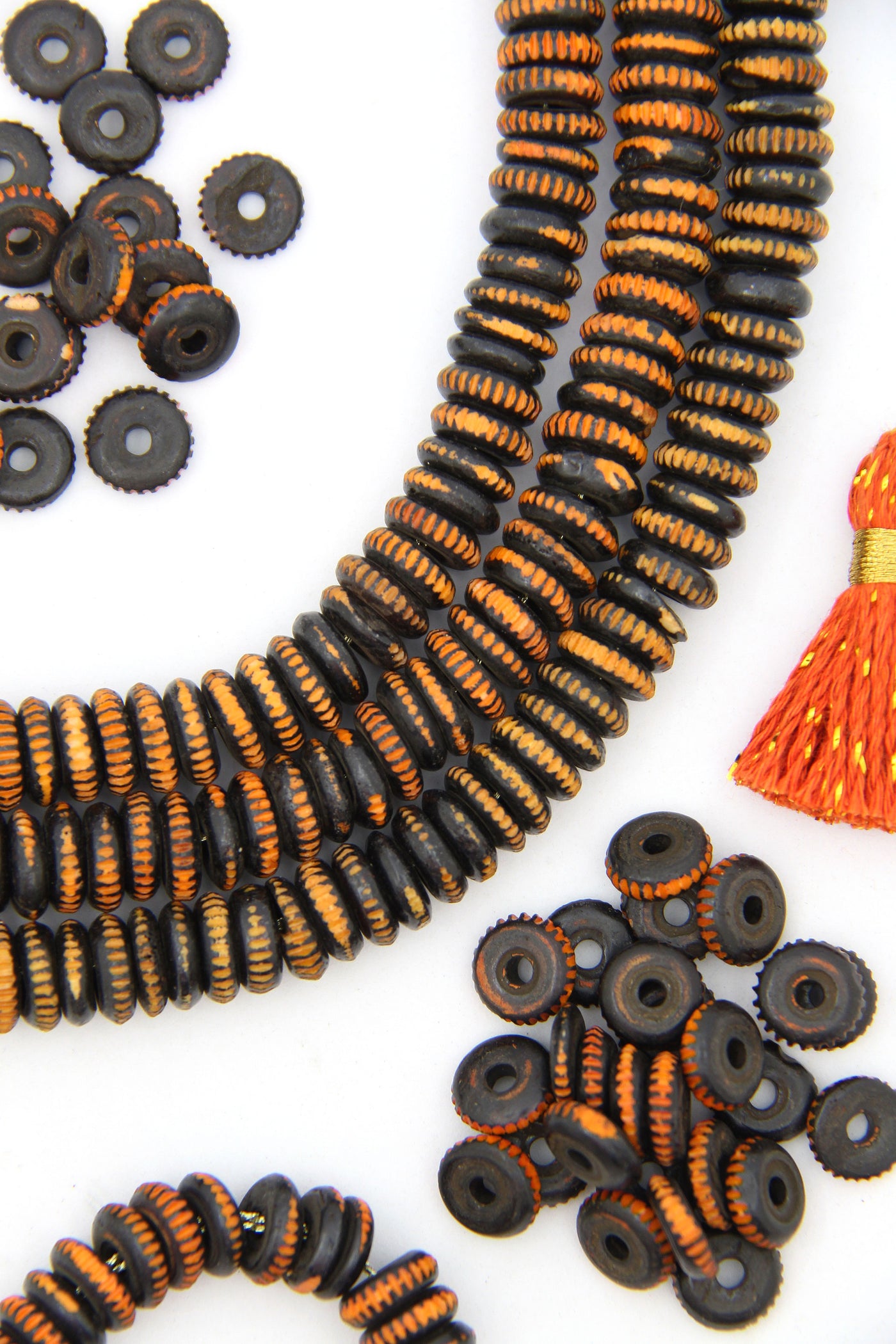 Artisan made Black and orange heishi beads