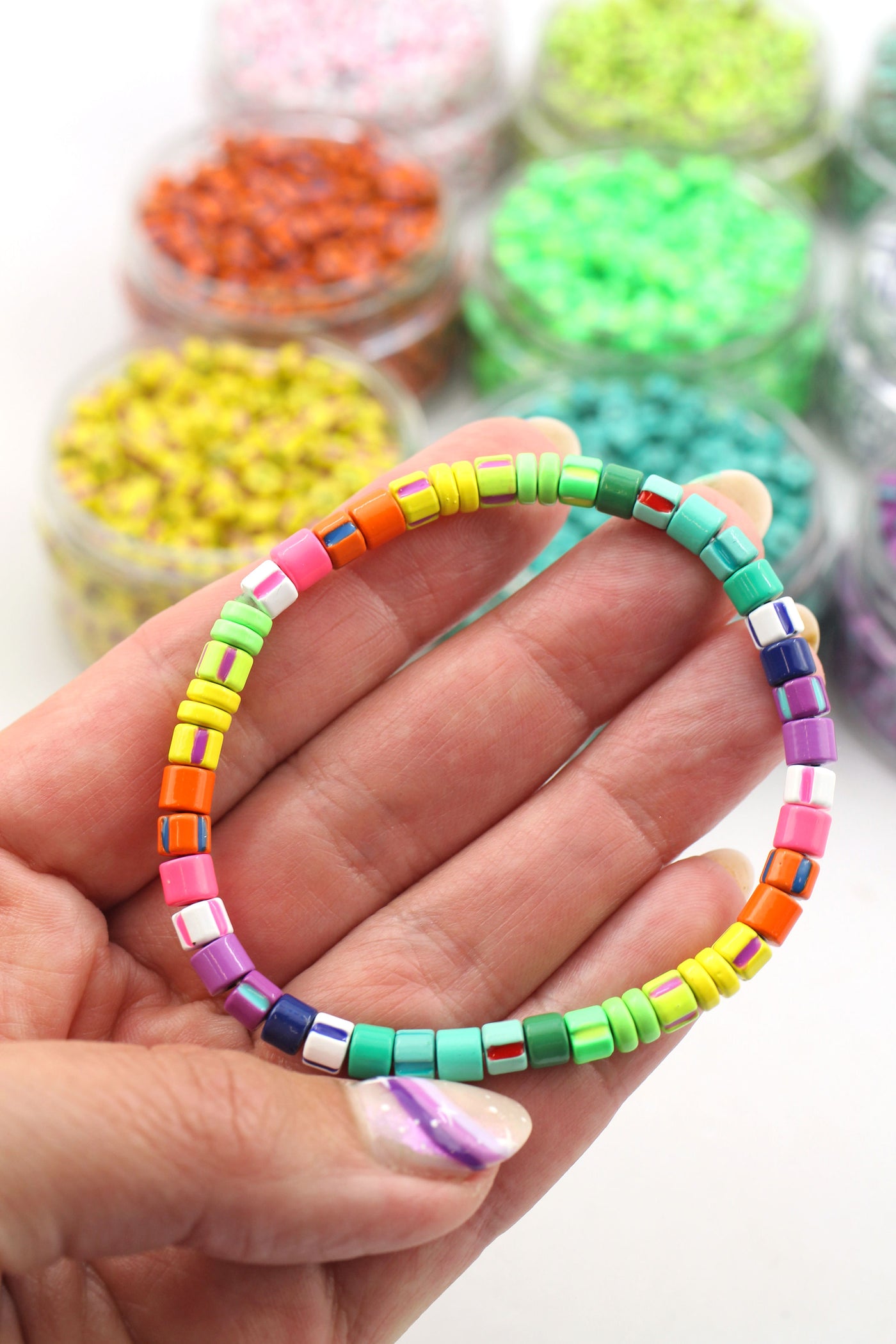 DIY your own set of stripey bracelets with these trendy enamel coated tubular beads.