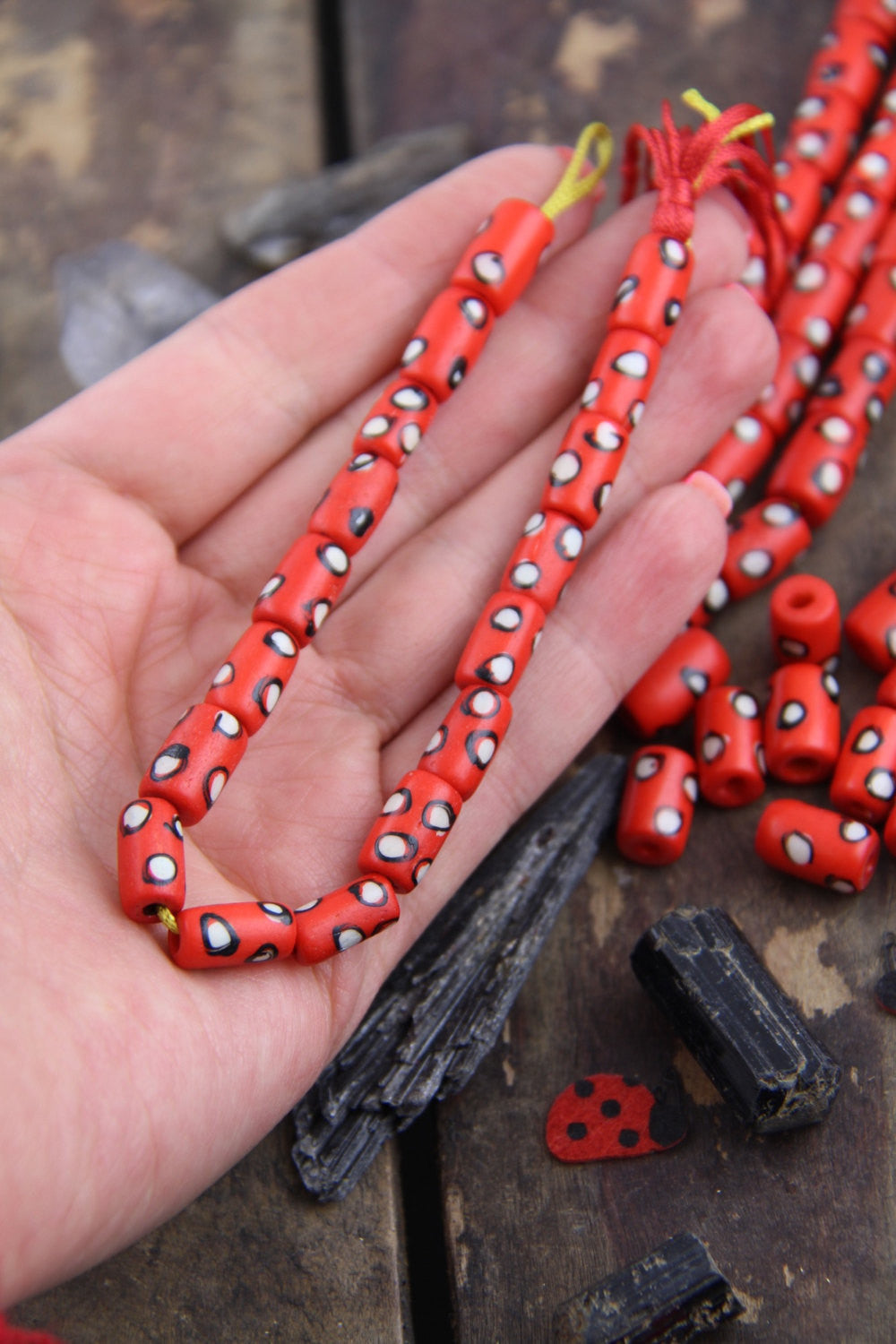 White Dotted Tubes: Hand Painted Red Bone Beads, 7x13mm, 16 pieces - ShopWomanShopsWorld.com. Bone Beads, Tassels, Pom Poms, African Beads.
