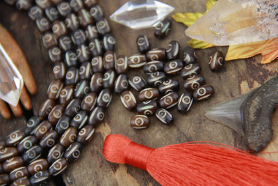 Lined Target Barrel: Brown & White Oval Bone Beads, 5x8mm, 25 pieces - ShopWomanShopsWorld.com. Bone Beads, Tassels, Pom Poms, African Beads.