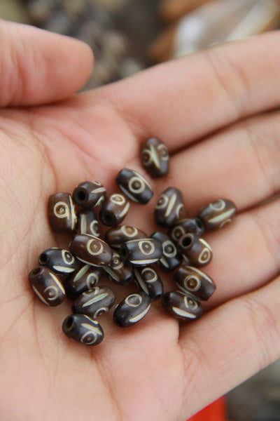 Lined Target Barrel: Brown & White Oval Bone Beads, 5x8mm, 25 pieces - ShopWomanShopsWorld.com. Bone Beads, Tassels, Pom Poms, African Beads.