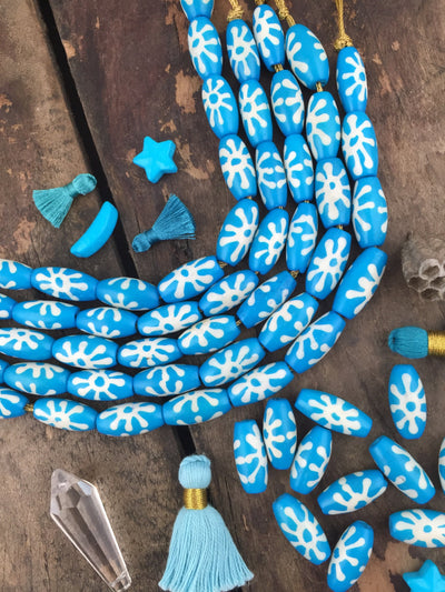 Turquoise Sunburst: Hand Painted Bone Beads, 10x17mm, 11 pieces - ShopWomanShopsWorld.com. Bone Beads, Tassels, Pom Poms, African Beads.