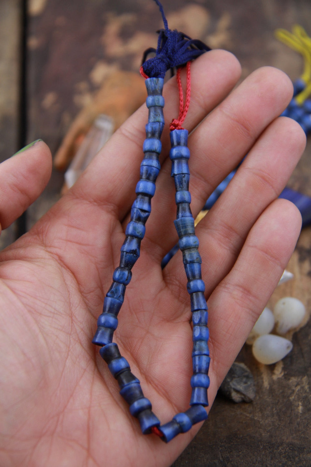 Indigo Hour Glass Barrel: Hand Carved Bone Beads, 6x14mm, 15 pieces - ShopWomanShopsWorld.com. Bone Beads, Tassels, Pom Poms, African Beads.