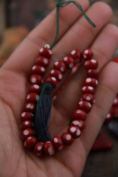 Burgundy Ladybug: Polka Dotted Maroon Bone Beads, 6x8mm, 30 pieces - ShopWomanShopsWorld.com. Bone Beads, Tassels, Pom Poms, African Beads.