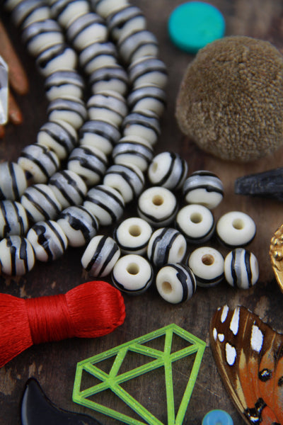 Cream Orbit Rondelle Bone Beads : Cream, Silver & Black Painted, 8x7mm, Natural Craft, Jewelry Making Supplies, Beads For Mala's, 28 pcs - ShopWomanShopsWorld.com. Bone Beads, Tassels, Pom Poms, African Beads.