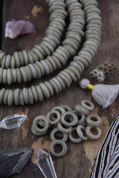 Grey Dutch Donut Dogan Beads, 11-12mm, 10 pieces - ShopWomanShopsWorld.com. Bone Beads, Tassels, Pom Poms, African Beads.