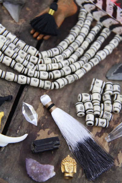 Cream Tribal Target Bone Beads, 8x12mm, 16 pieces - ShopWomanShopsWorld.com. Bone Beads, Tassels, Pom Poms, African Beads.