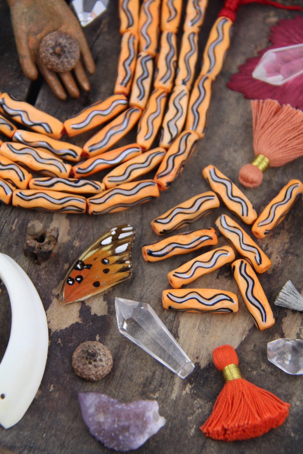 Orange Squiggle Barrel: Hand Painted Bone Beads, 7x27mm, 8 pieces - ShopWomanShopsWorld.com. Bone Beads, Tassels, Pom Poms, African Beads.
