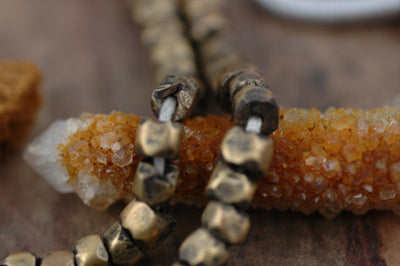 African Brass Hex Nut Beads 6x5mm, 11" strand - ShopWomanShopsWorld.com. Bone Beads, Tassels, Pom Poms, African Beads.