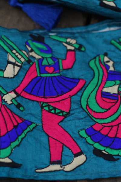 Teal Sword Dance: Bright Embroidered Silk Trim, Ribbon, Sari Border, India 5 1/2"x 1 yard, Traditional Indian Scene, Sewing Supplies, Fabric - ShopWomanShopsWorld.com. Bone Beads, Tassels, Pom Poms, African Beads.