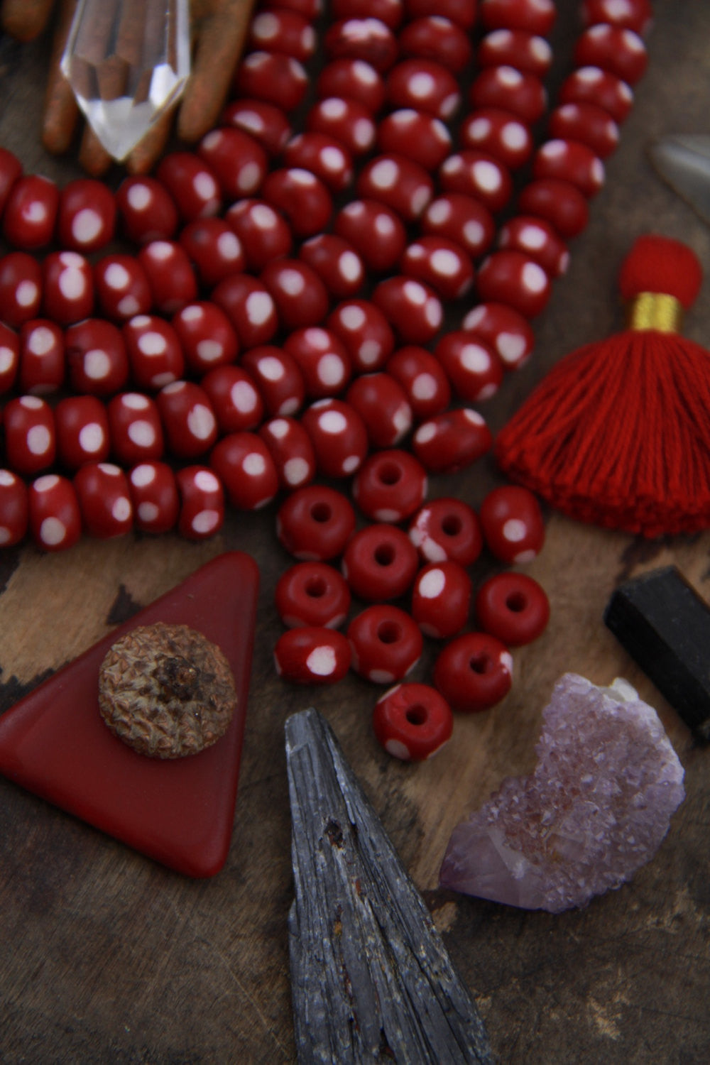 Burgundy Ladybug: Polka Dotted Maroon Bone Beads, 6x8mm, 30 pieces - ShopWomanShopsWorld.com. Bone Beads, Tassels, Pom Poms, African Beads.