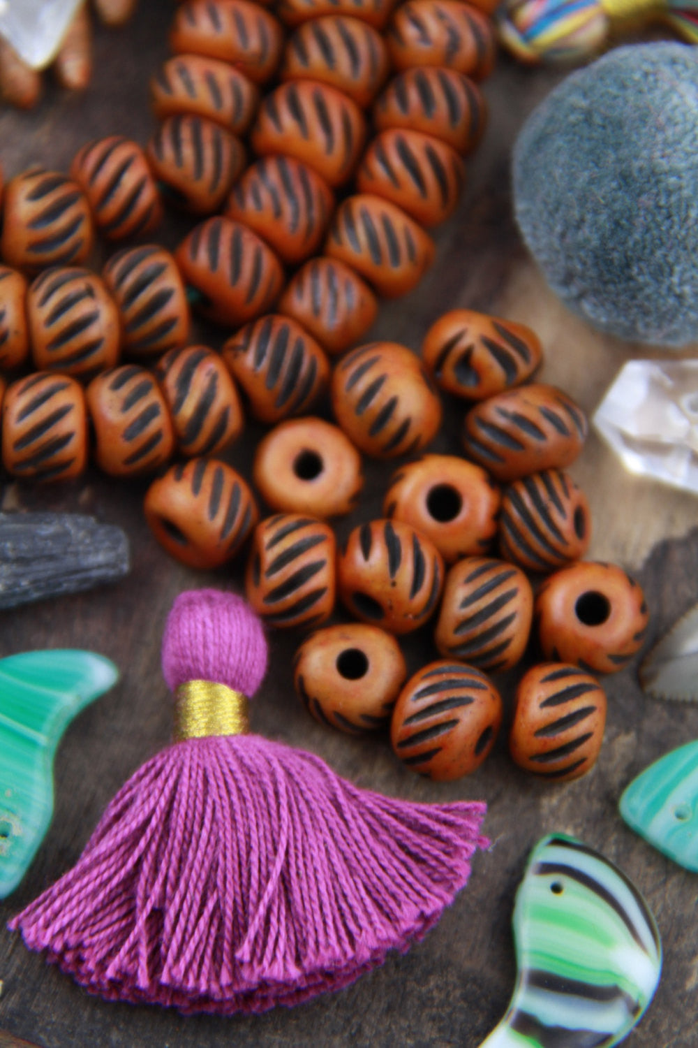 Grooved Salmon Chestnut: Hand Carved Bone Beads, 10x8mm, 27 pieces - ShopWomanShopsWorld.com. Bone Beads, Tassels, Pom Poms, African Beads.