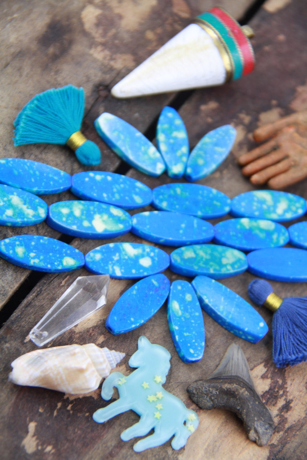 Speckled Blue Chicklet: Painted Oval Bone Beads, 31x4mm, 7 pieces - ShopWomanShopsWorld.com. Bone Beads, Tassels, Pom Poms, African Beads.