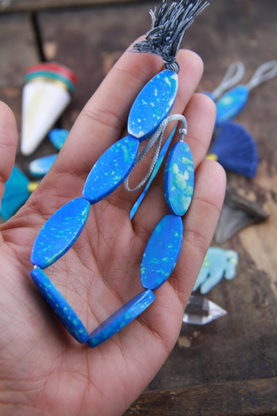 Speckled Blue Chicklet: Painted Oval Bone Beads, 31x4mm, 7 pieces - ShopWomanShopsWorld.com. Bone Beads, Tassels, Pom Poms, African Beads.