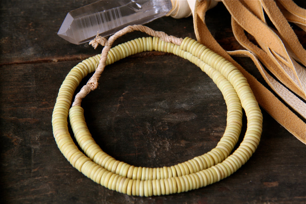 Buttercup: Vintage Patel Yellow Glass African Beads, 9x2mm - ShopWomanShopsWorld.com. Bone Beads, Tassels, Pom Poms, African Beads.