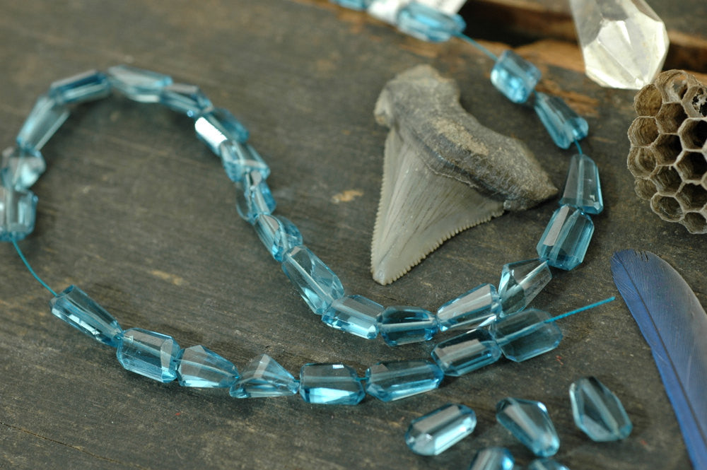 Blue Ice: London Blue Topaz Faceted Nugget Beads,1 bead, 6x10mm - ShopWomanShopsWorld.com. Bone Beads, Tassels, Pom Poms, African Beads.