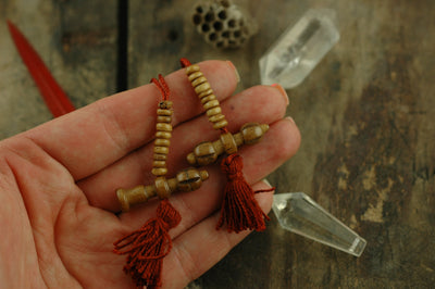 Count Your Mantras: Red Tasseled Mala Counters, Prayer Beads, Dorje, Bell - ShopWomanShopsWorld.com. Bone Beads, Tassels, Pom Poms, African Beads.