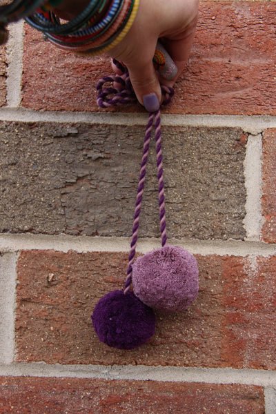 Purple Pom Pom Swag, 2" Pom, 1.5" Pom - ShopWomanShopsWorld.com. Bone Beads, Tassels, Pom Poms, African Beads.