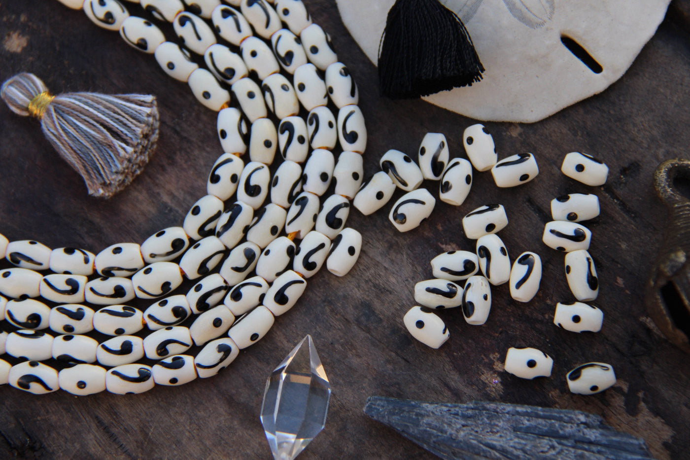 Comma Barrel: Black & White Hand Painted Bone Beads, 6x8mm, 22 pieces - ShopWomanShopsWorld.com. Bone Beads, Tassels, Pom Poms, African Beads.