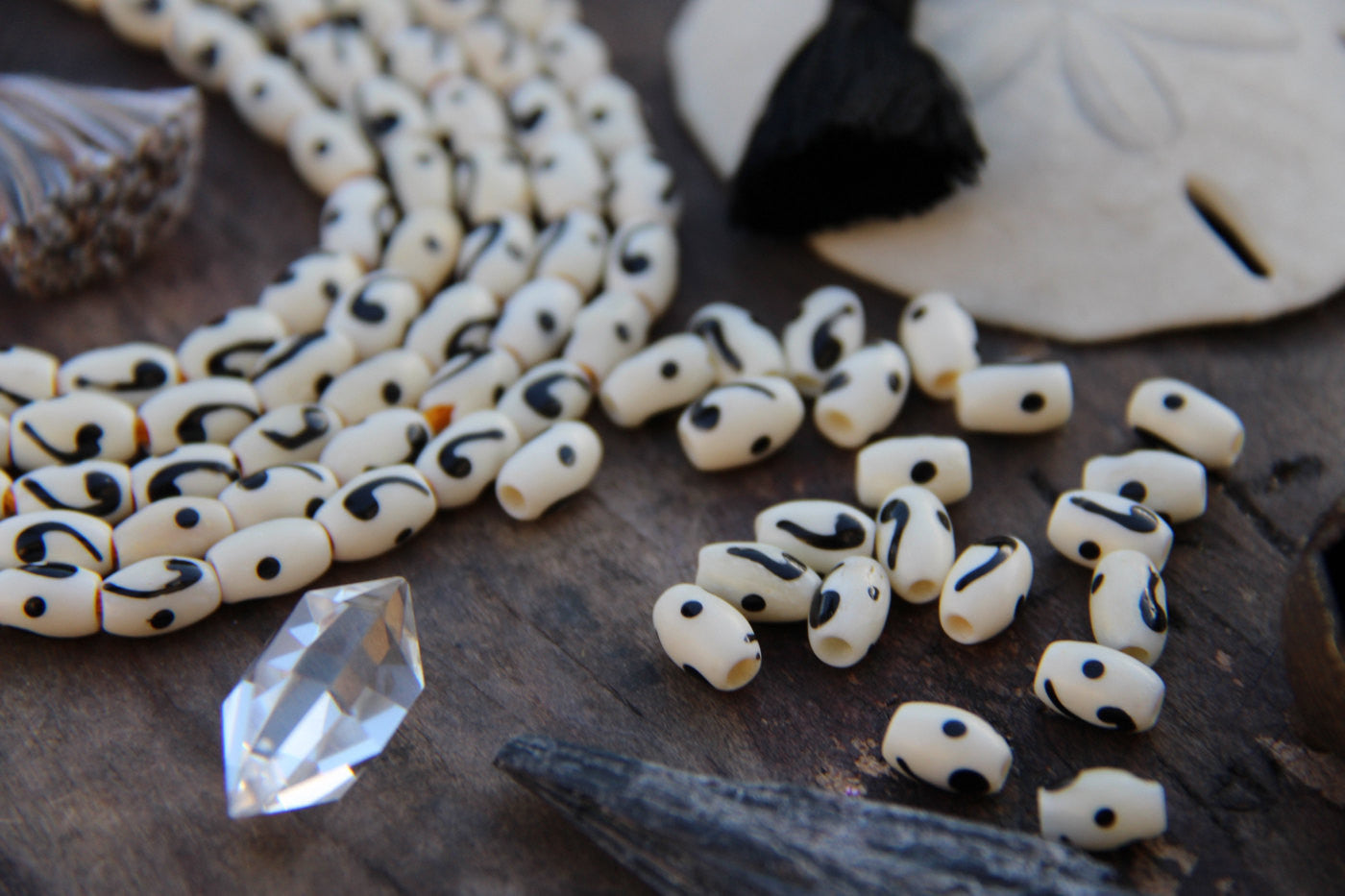 Comma Barrel: Black & White Hand Painted Bone Beads, 6x8mm, 22 pieces - ShopWomanShopsWorld.com. Bone Beads, Tassels, Pom Poms, African Beads.